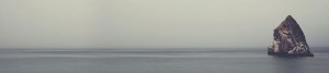Peaceful design of ocean and standing rock.
