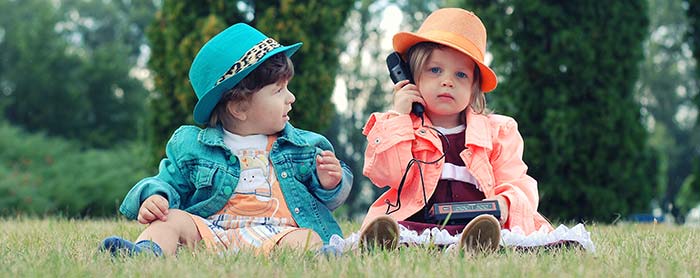 Little girls playing with technology