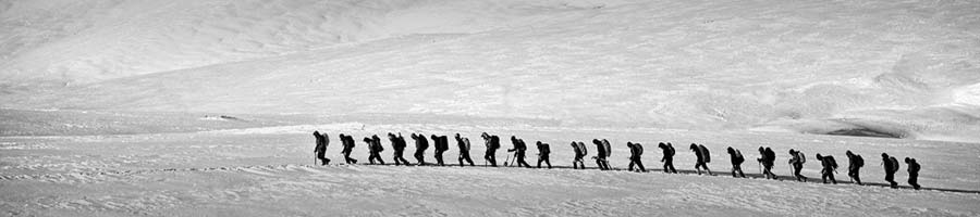 Persevering through the snow, group of hikers.