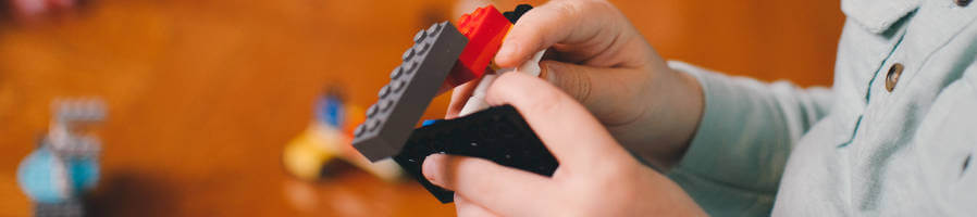 Child playing with legos.